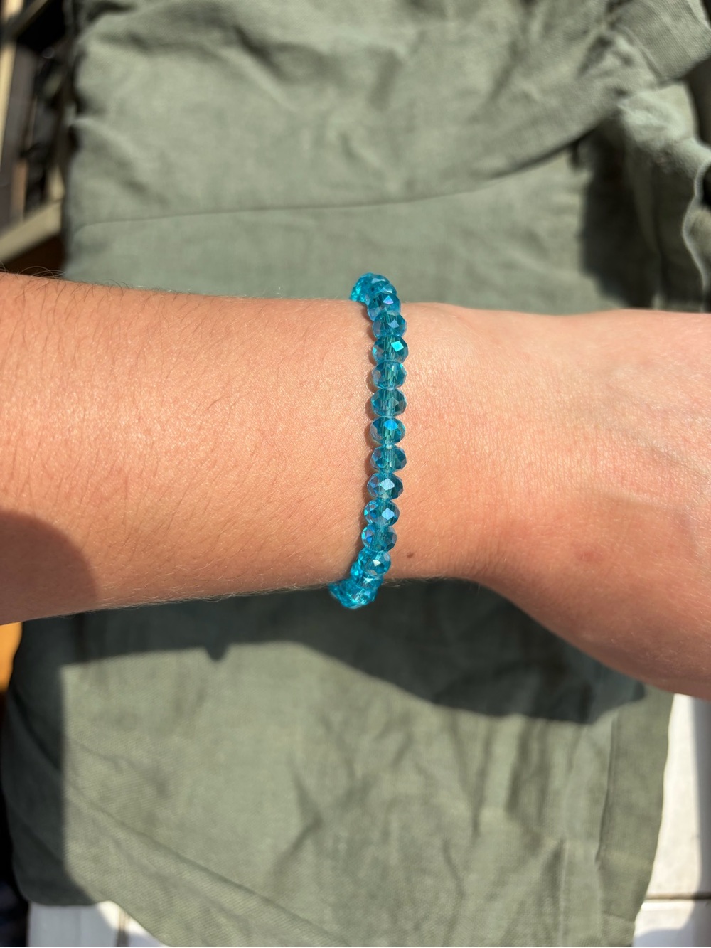 Sparkling Teal Bead Stretch Bracelet with Round Logo Charm
